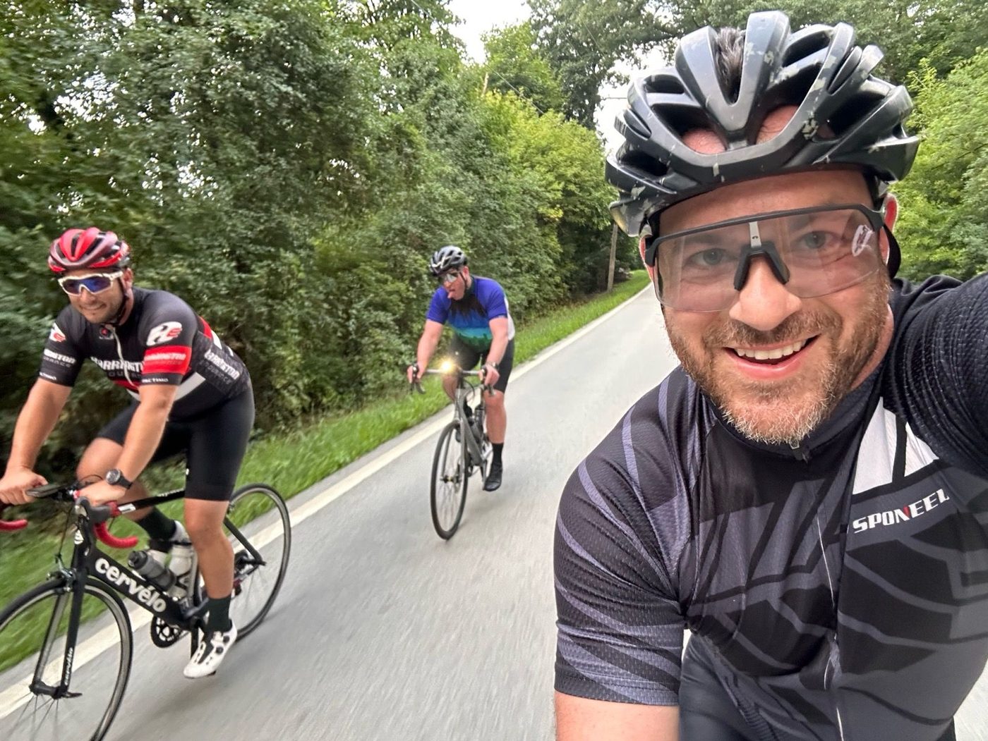 Three Graveleros riding on a summer road